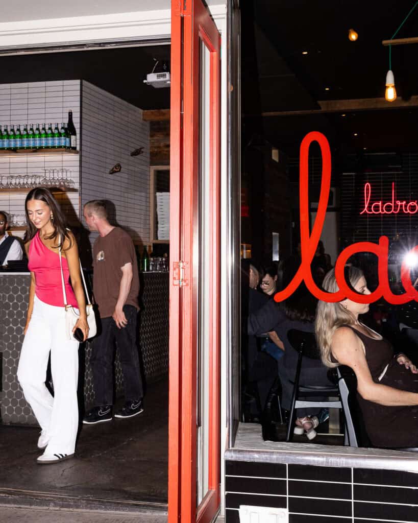 People socializing in a lively bar setting.