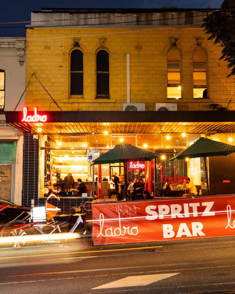 Lively nighttime scene outside a vibrant bar.